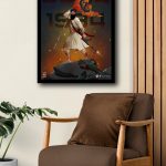 Framed June 1984 Sikh warrior art print on a wall above a brown armchair in a home decor setting.