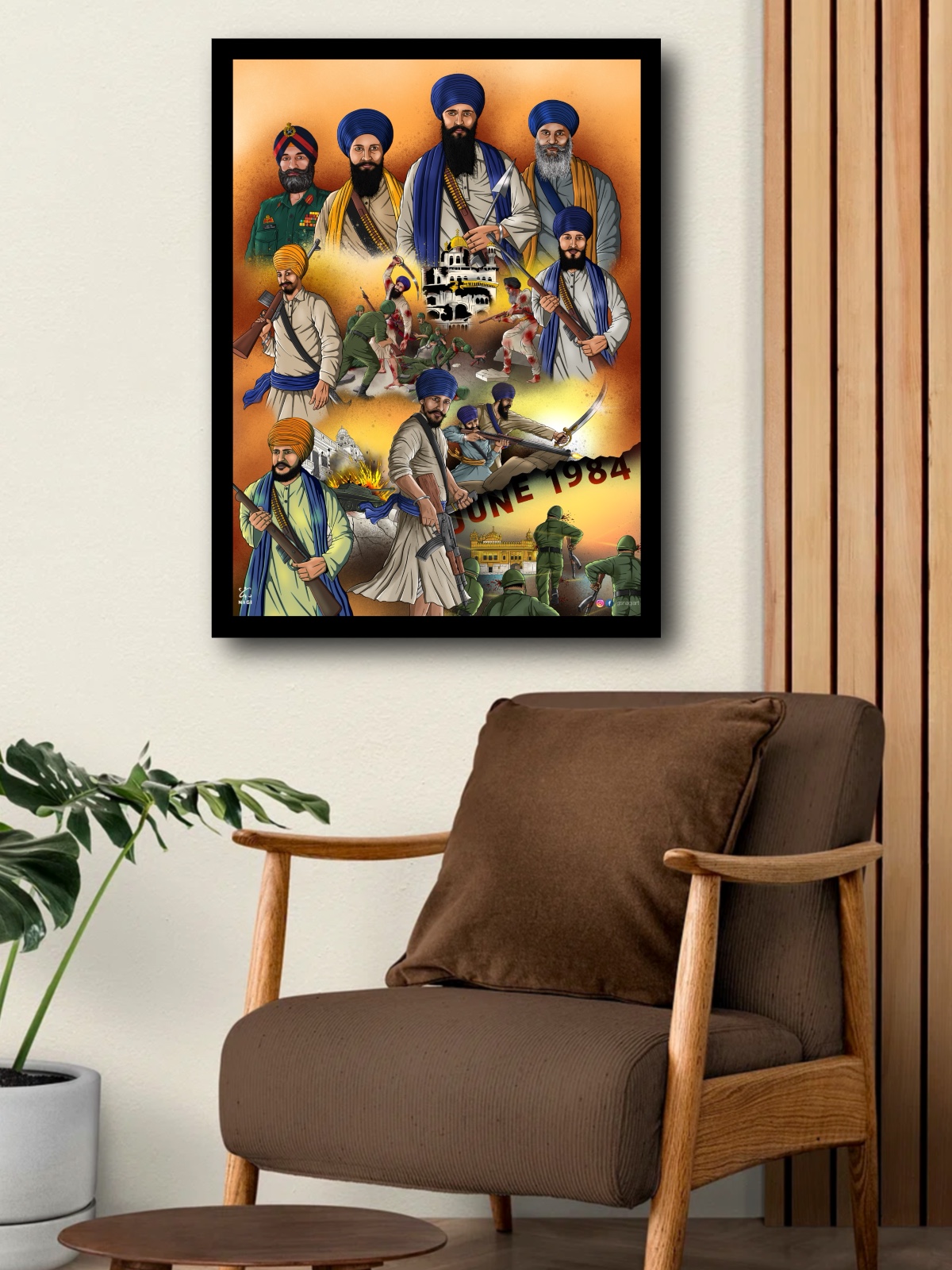 Framed Sikh history art print commemorating June 1984 hanging on a wall above a brown armchair.